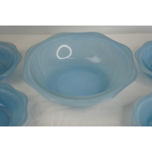 113 - A set of vintage Pyrex blue glass bowls.