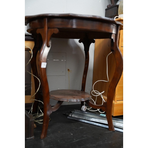 114 - A mahogany table with undershelf.