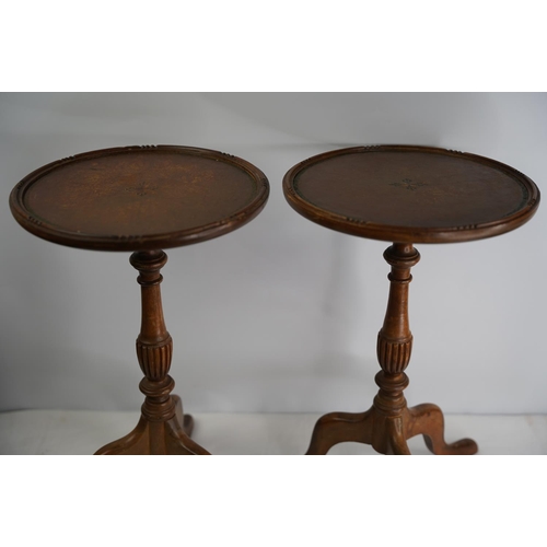 125 - Two wooden wine tables on tripod base.