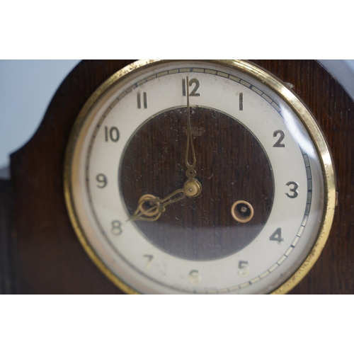 126 - Two vintage wood cased mantle clocks.