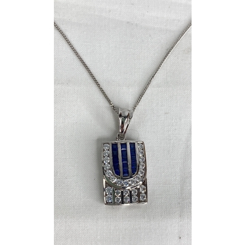 150 - A 9ct white gold pendant and chain.