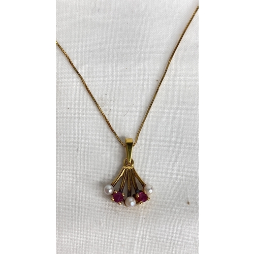 152 - A 9ct gold ruby and pearl pendant and an 18