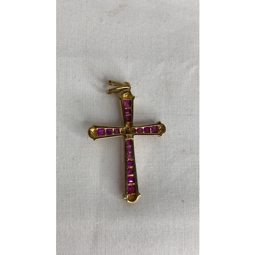 160 - A 9ct gold ruby and diamond cross pendant.