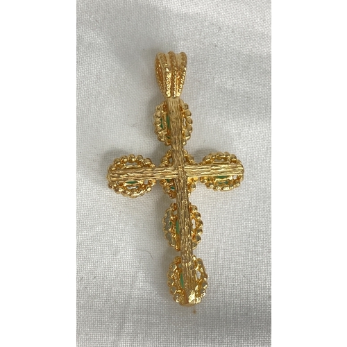 163 - A 9ct gold and emerald cross pendant.