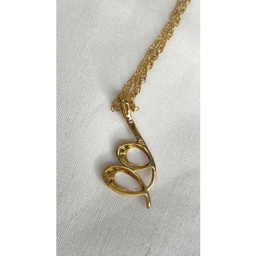 172 - A 9ct gold diamond heart pendant and 18