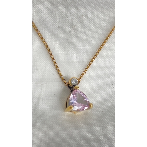 179 - A pink sapphire and diamond pendant, 18