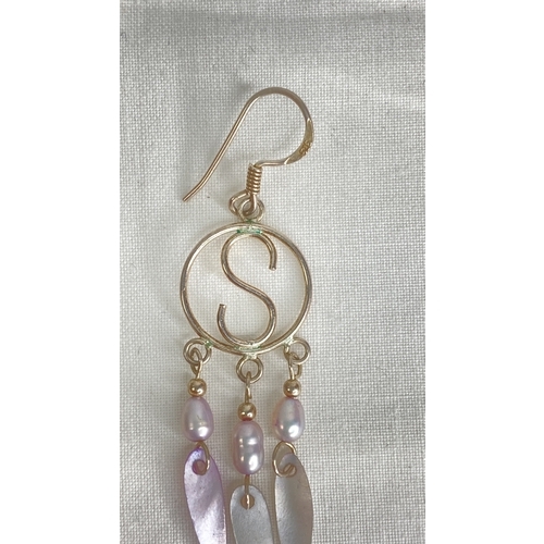 181 - A pair of Sterling silver and shell earrings.