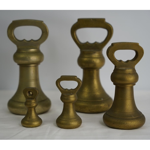 206 - A set of five brass butcher weights.