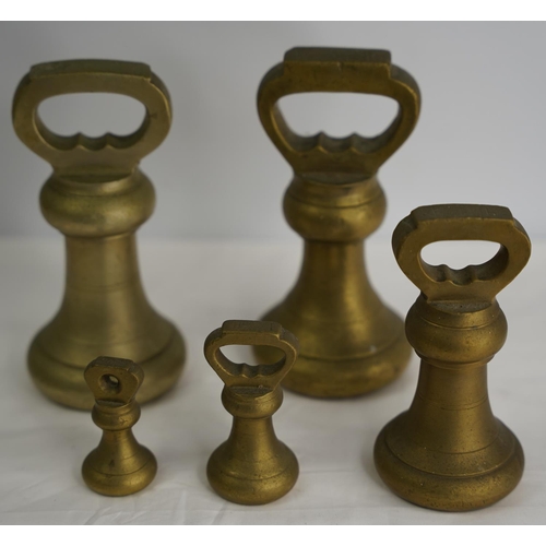 206 - A set of five brass butcher weights.