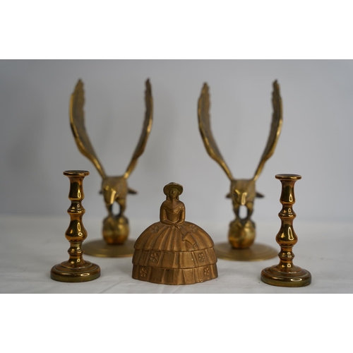 209 - A pair of vintage brass eagles, a 'Pretty Ladies' brass bell and a pair of small candlesticks..