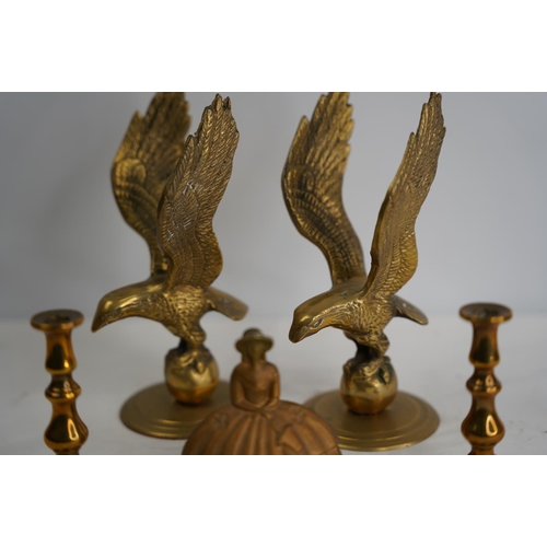 209 - A pair of vintage brass eagles, a 'Pretty Ladies' brass bell and a pair of small candlesticks..