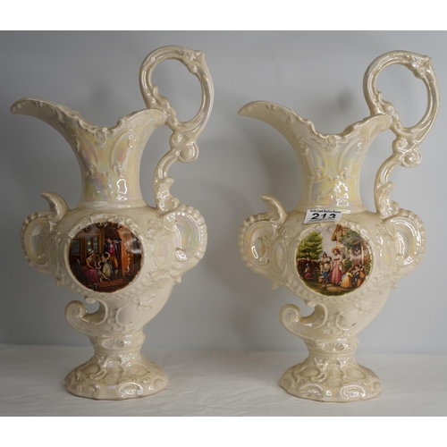 213 - A pair of antique style jugs.