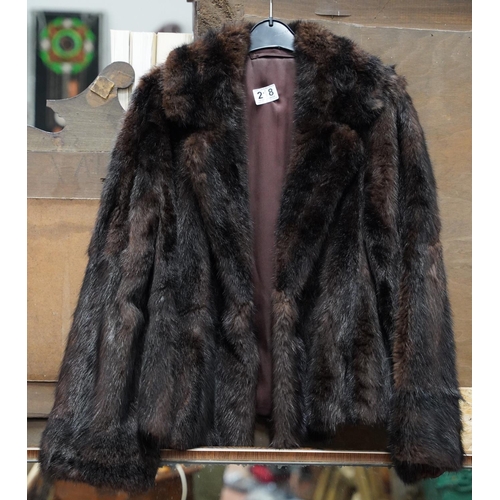 218 - A vintage fur coat.