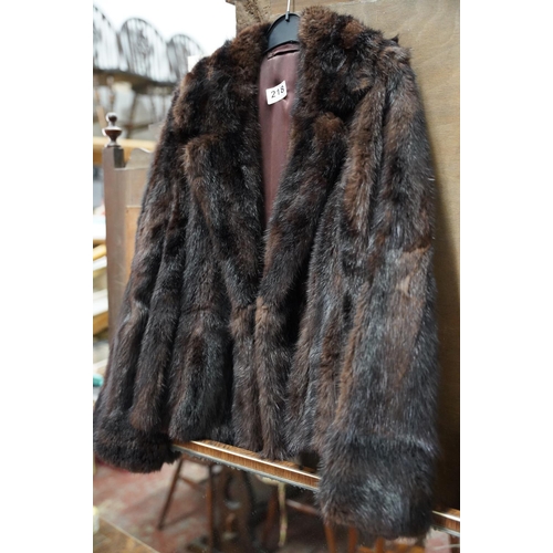 218 - A vintage fur coat.