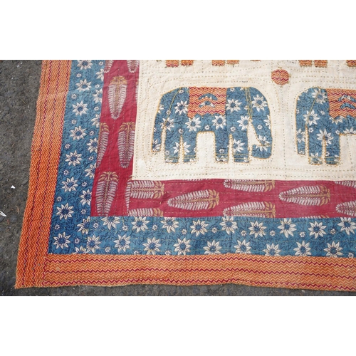 227 - A stunning vintage patchwork throw with elephant design.