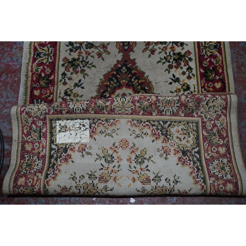 230 - A floral patterned floor runner.