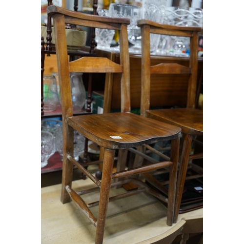 235 - A pair of vintage church chairs.