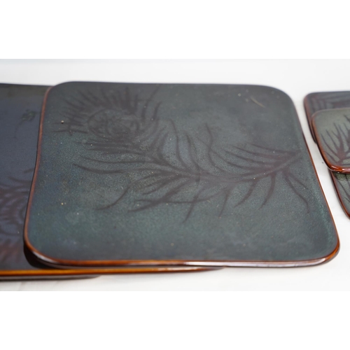 240 - A ceramic set of placemats and coasters with leaf patterned design.