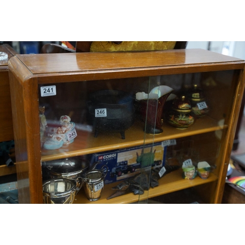 241 - A vintage bookcase with sliding glass doors.