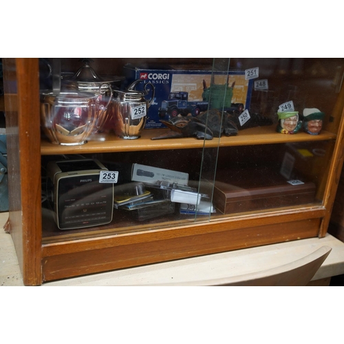 241 - A vintage bookcase with sliding glass doors.