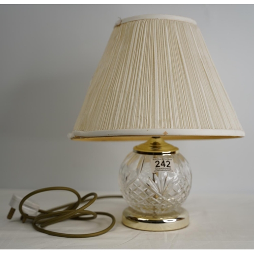 242 - A crystal table lamp and shade.