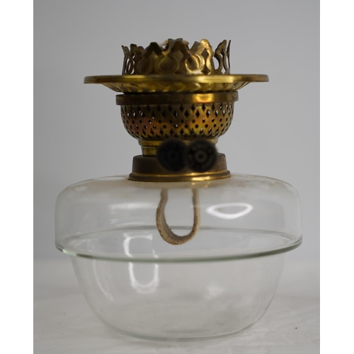 259 - A vintage clear glass oil lamp font and burner.