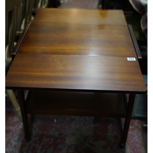 262 - A vintage teak drop leaf table on casters.