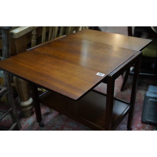 262 - A vintage teak drop leaf table on casters.