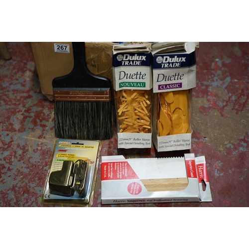 267 - A large box lot of assorted paint brushes, rollers etc.