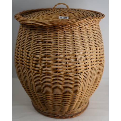 268 - A rattan linen basket and lid.