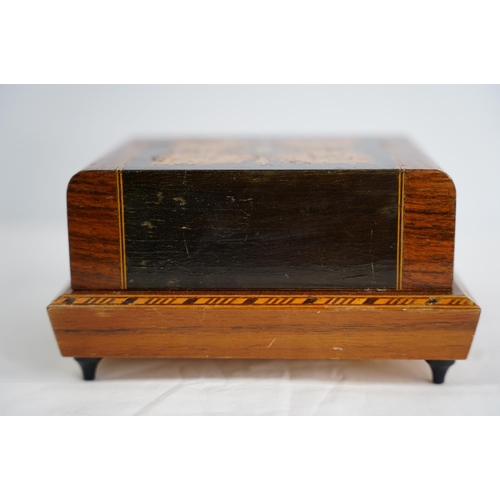 281 - A decorative wooden musical cigarette box.