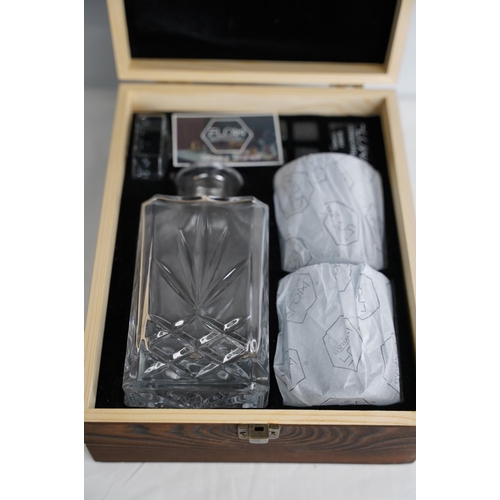 289 - A wooden cased Flow Barware decanter set.