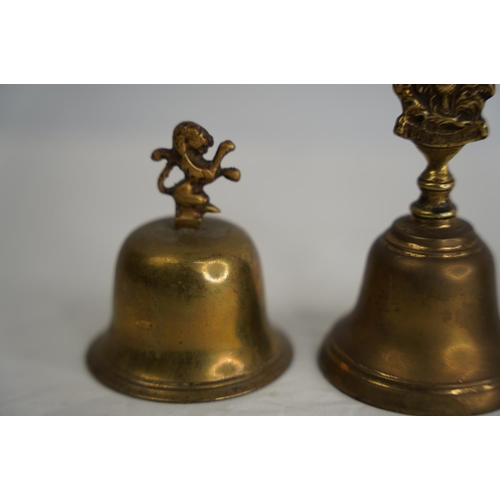 294 - Three vintage brass bells (one a/f) and more.