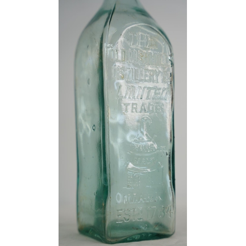 297 - An Old Bushmills Distillery glass whiskey bottle.