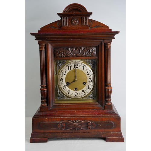 303 - A large antique mahogany cased mantle clock, in need of some restoration.