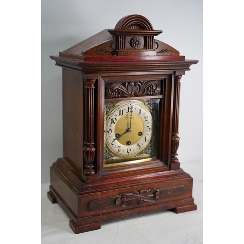 303 - A large antique mahogany cased mantle clock, in need of some restoration.