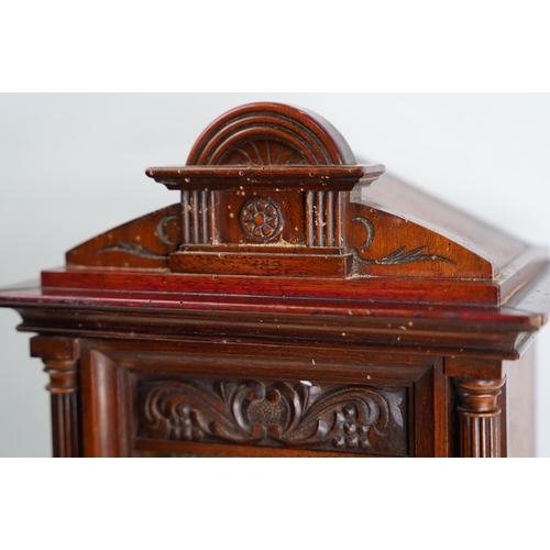 303 - A large antique mahogany cased mantle clock, in need of some restoration.