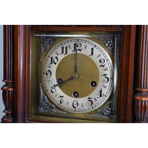 303 - A large antique mahogany cased mantle clock, in need of some restoration.