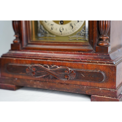 303 - A large antique mahogany cased mantle clock, in need of some restoration.