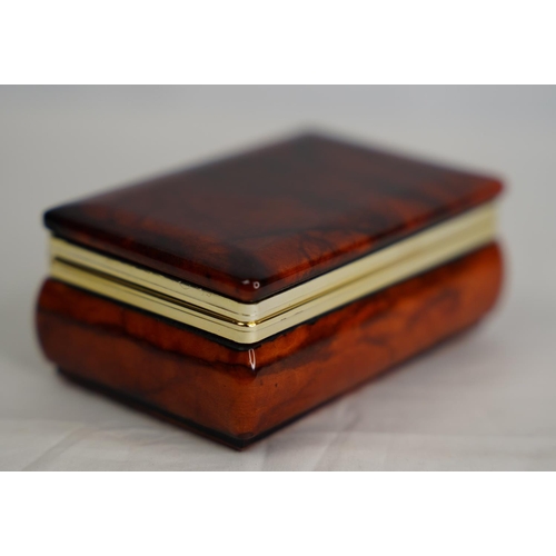 309 - A polished stone trinket box.