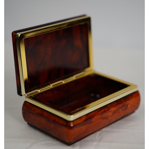 309 - A polished stone trinket box.