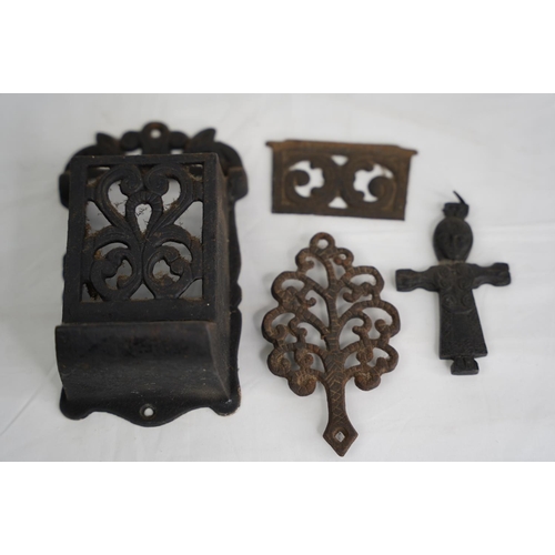 311 - An unusual antique Crucifix, cast metal trivet, match holder & more