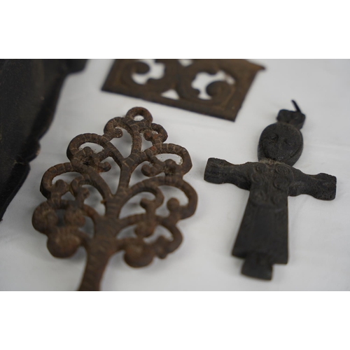 311 - An unusual antique Crucifix, cast metal trivet, match holder & more