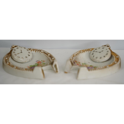 315 - A pair of antique ceramic 'change trays' with horseshoe and pocket watch design.