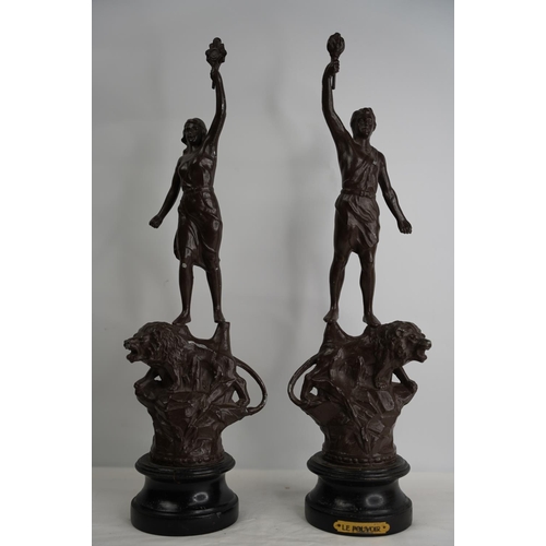 320 - A pair of metal figure statues.