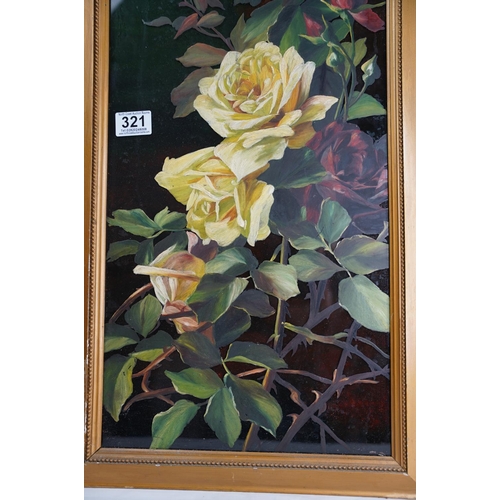 321 - A gilt framed floral painting on glass.