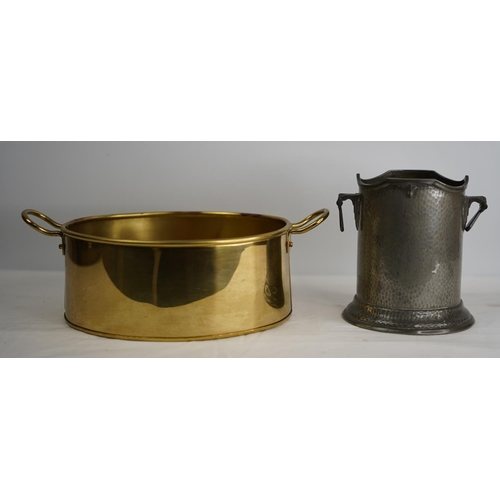 333 - A two handled brass pan and a vintage Period Pewter wine holder number 692.