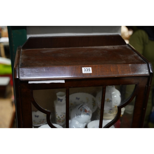 335 - A mahogany astra glazed single door display cabinet.