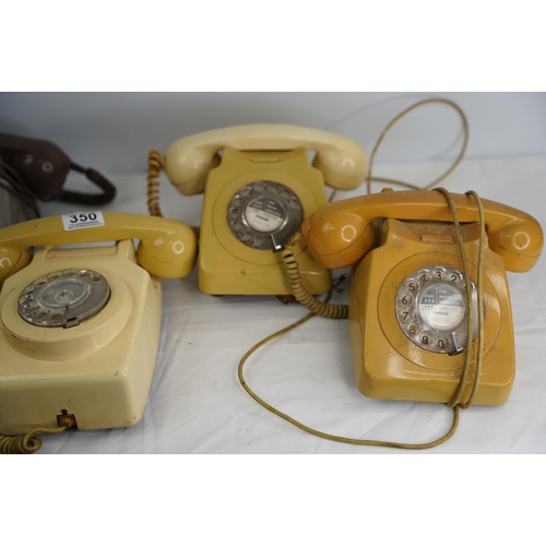 350 - Four vintage rotary telephones and another.