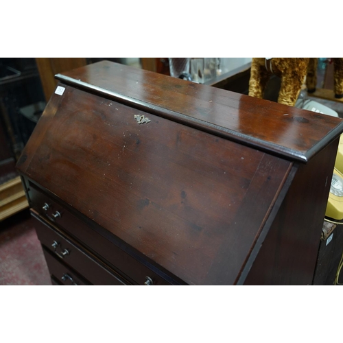 353 - A mahogany writing bureau.